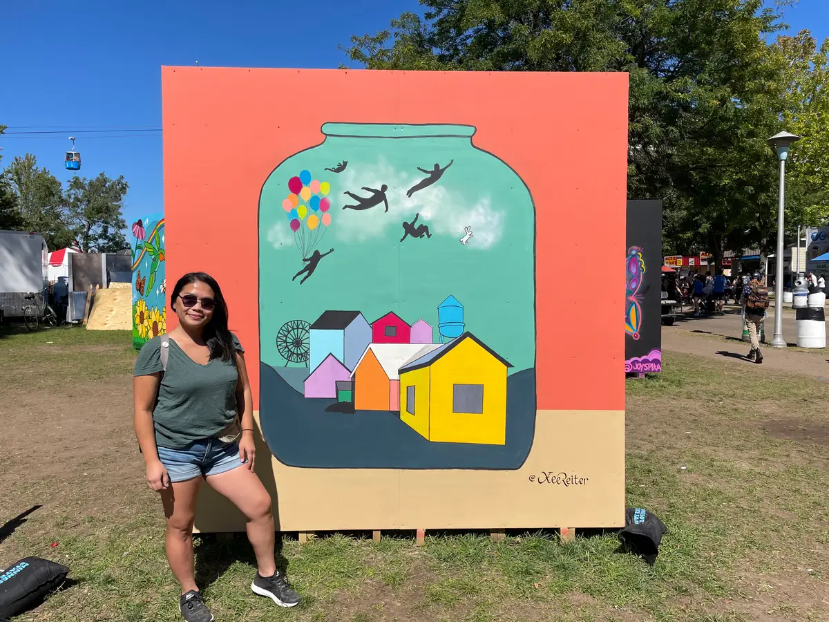 Joyful World mural painted live at the Minnesota State Fair Mural Park.